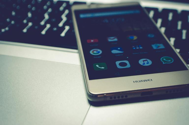 white huawei smartphone